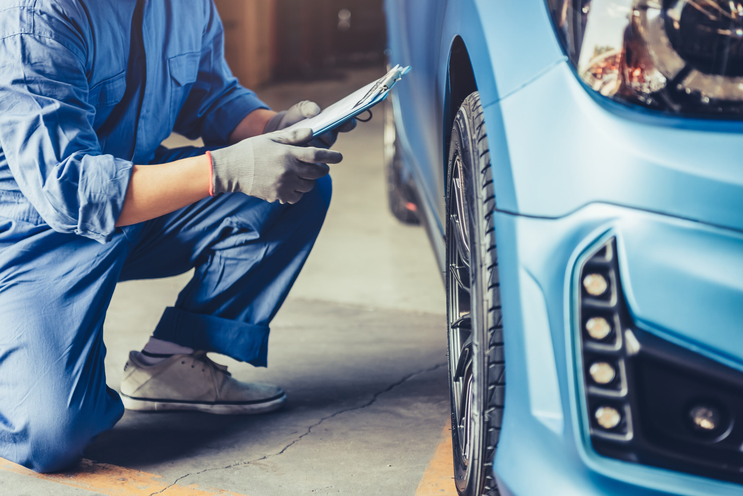 Certified vehicle appraiser performing a car inspection on an exotic vehicle Luxury car inspection and appraisal expert in Coconut Creek, Florida
